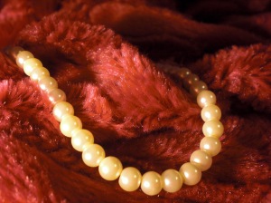 My pearl necklace and fluffy blanket, two other simple pleasures I enjoy.